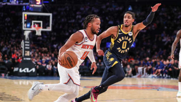 Knicks guard Jalen Brunson drives past Pacers guard Tyrese Haliburton.